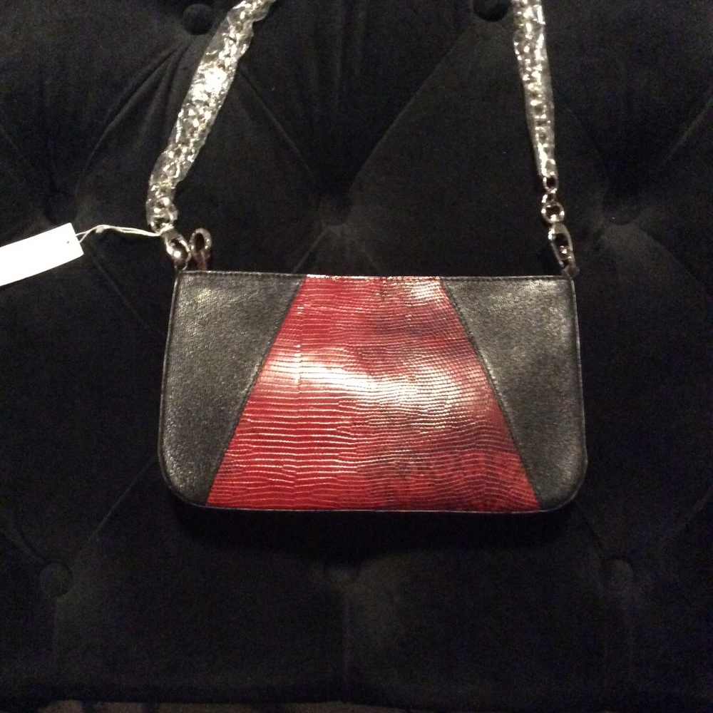 Small  Andrew Marc of N.Y. black and red genuine leather wrist handbag